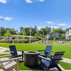 Beautiful turf flex field with seating around fire pit at Blu South homes for rent in Pineville